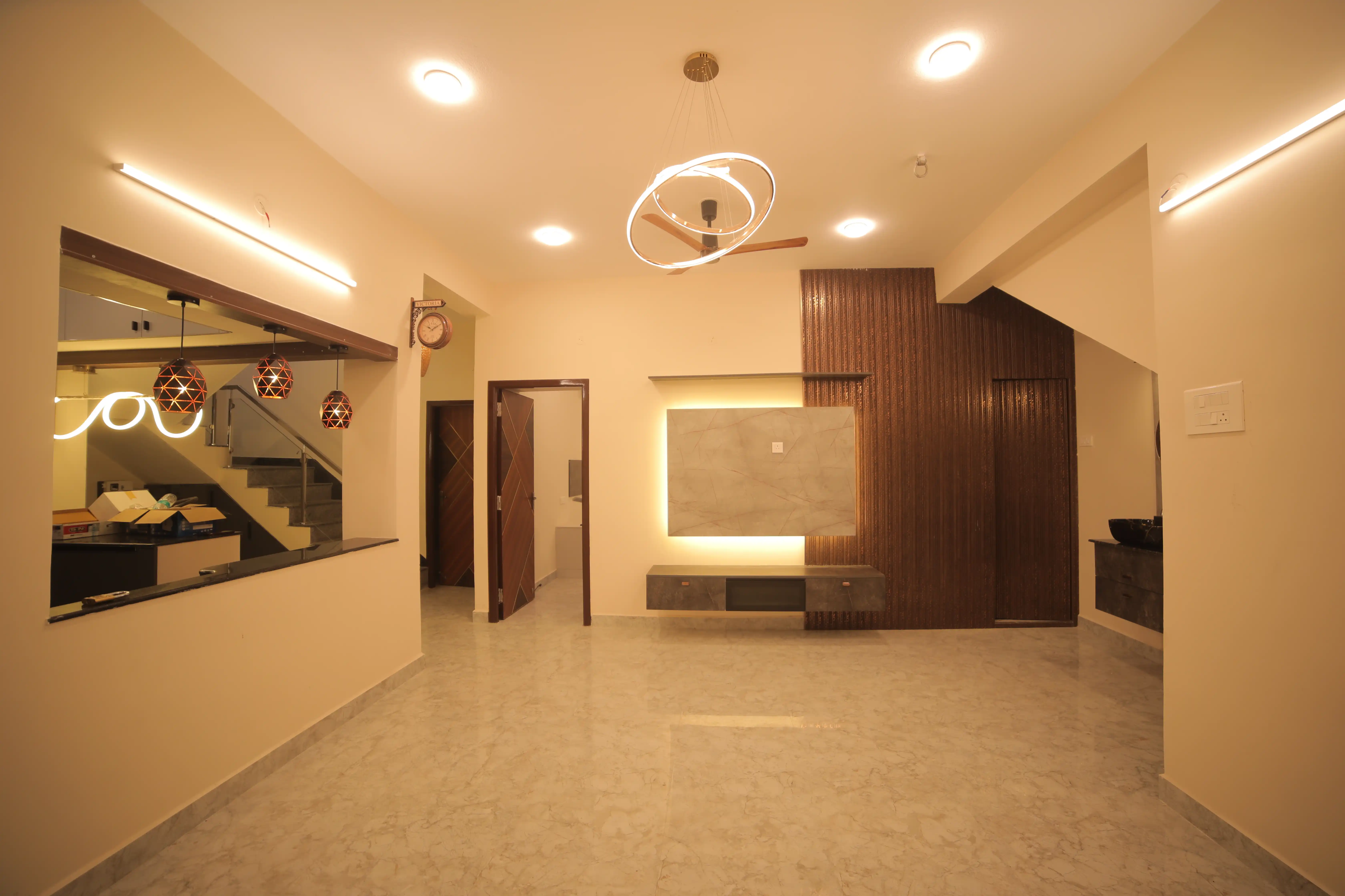 Living hall detail with layered ceiling lighting